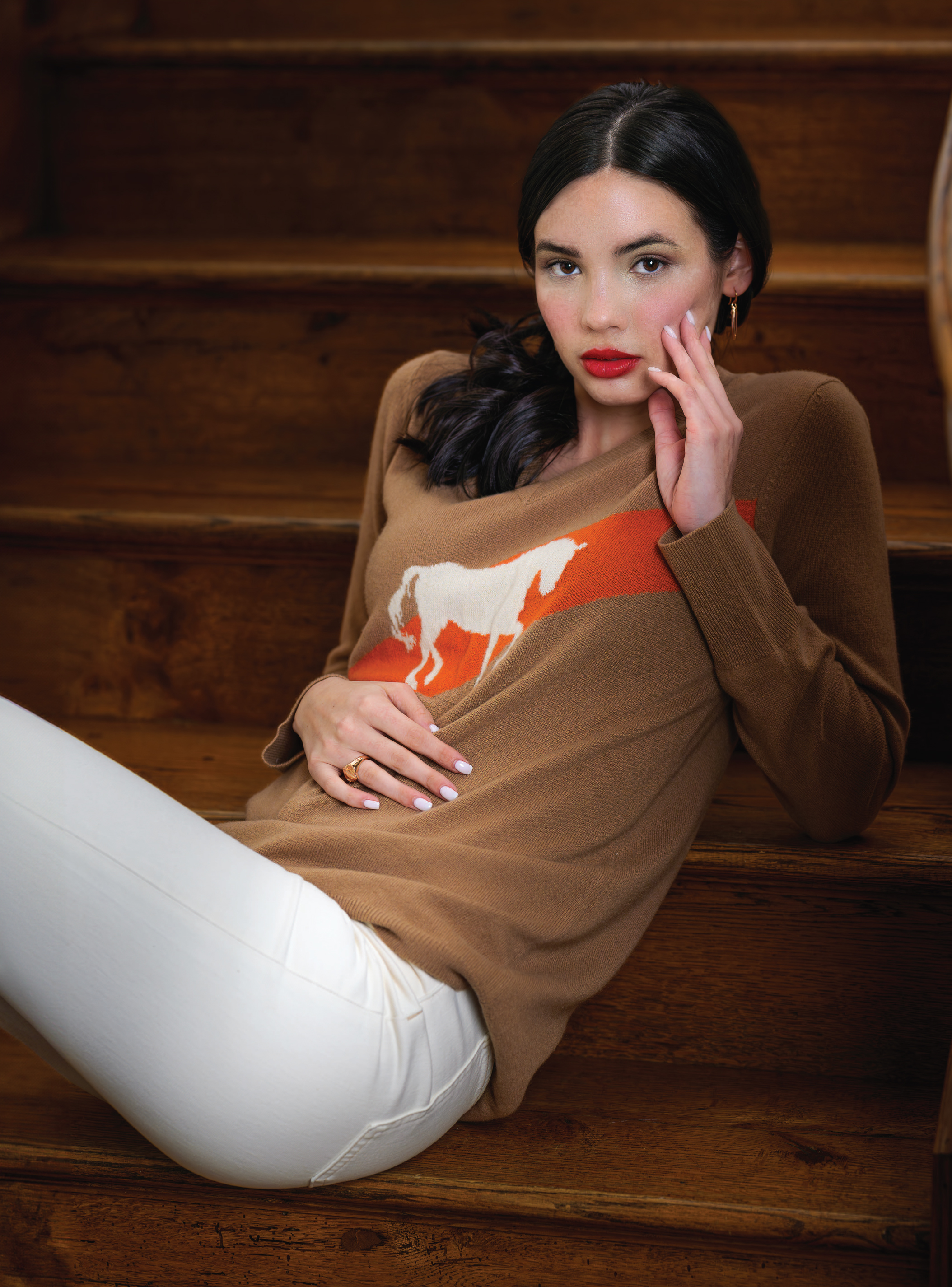 Dressage cashmere sweater ($297) from Vanner House; Veronica Beard Dylan ankle high-rise straight jeans ($298) from Peter Kate; all jewelry from REALM.